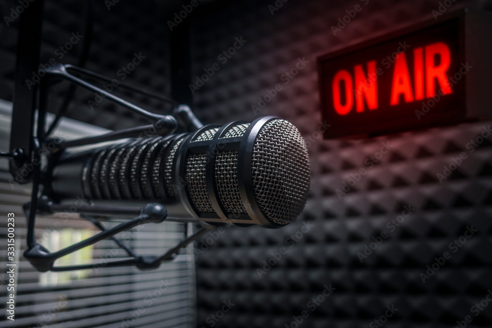 Professional microphone in radio station studio on air